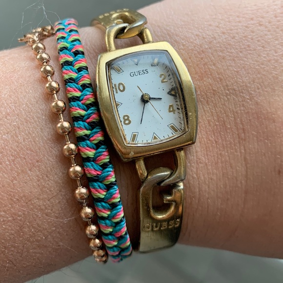 Guess interlocking G skinny gold watch main image 7